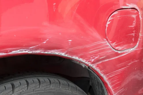 scratches on the side of the red car collision